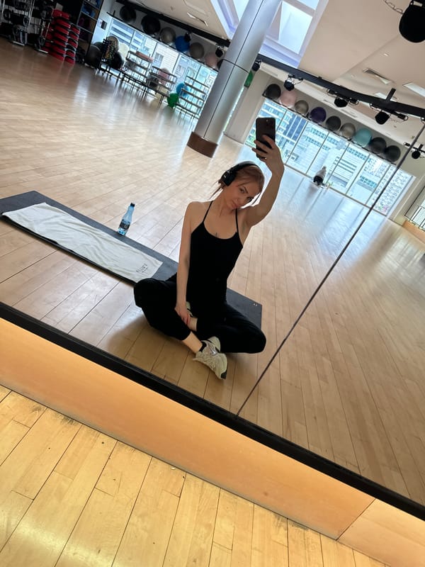 Woman Takes Gym Mirror Selfies During Workout Session