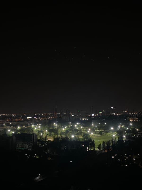 Nighttime panoramic view captures Bangkok's illuminated urban sprawl