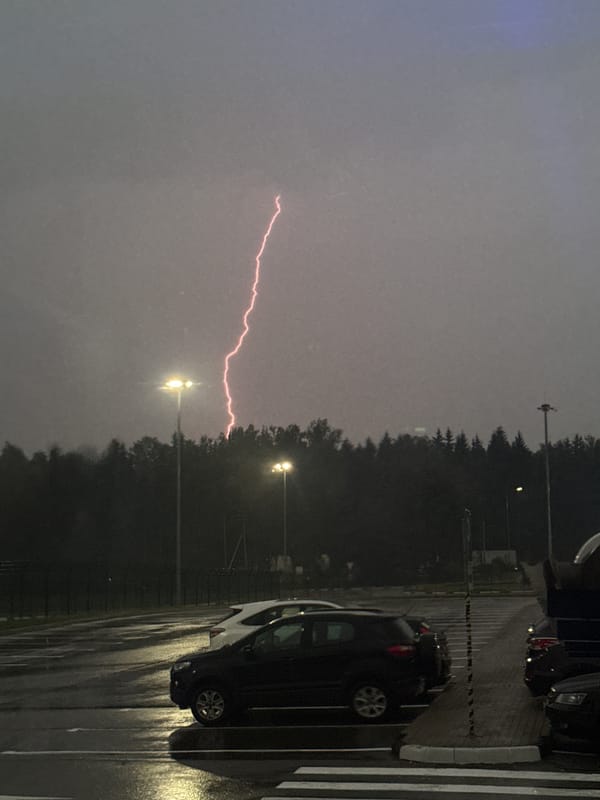 Evening thunderstorm with lightning strikes in Lupanovo, Russia