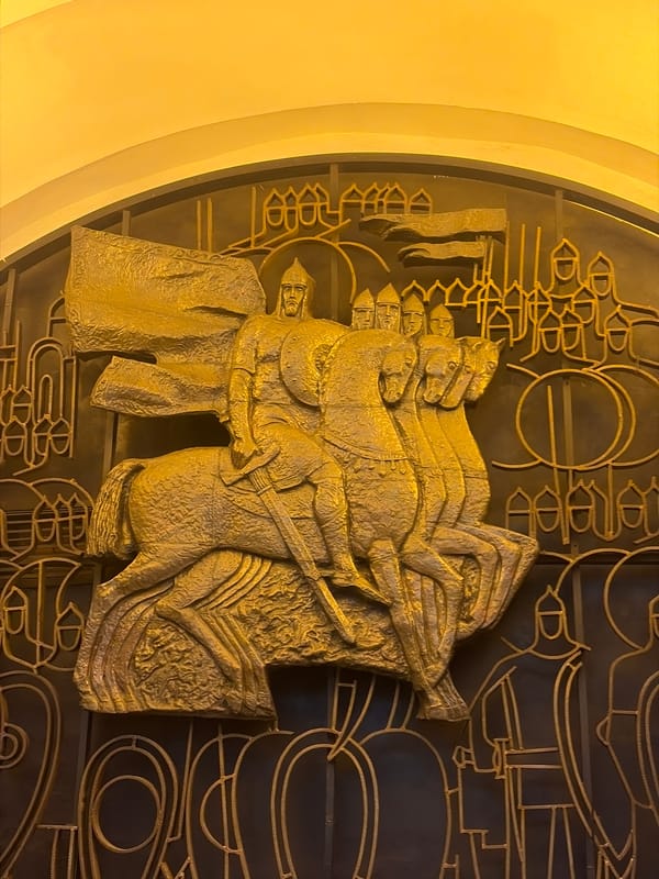 Gold relief sculptures documented at Saint Petersburg metro station