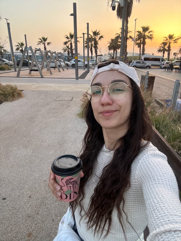 Woman takes sunset selfie in Bat Yam, Israel