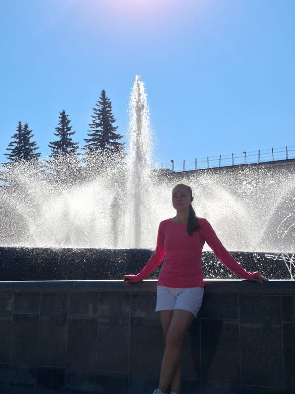 Sunny morning at Chaikovsky's fountain plaza with bronze sculpture