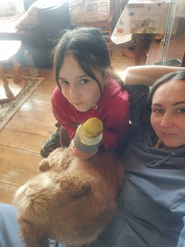 Family enjoys morning karaoke session with dog in Arkhangelskoye home