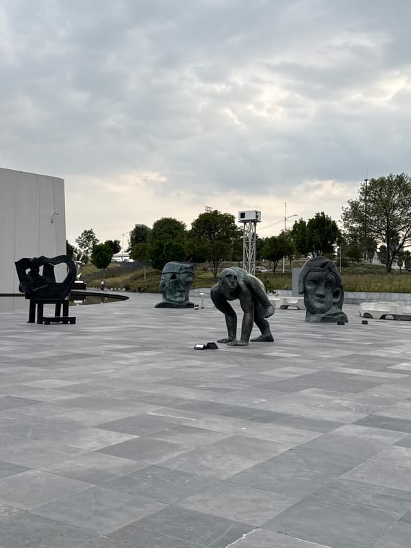 Visitor documents baroque museum sculptures and architecture in Mexico