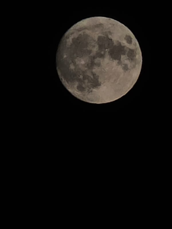Full moon rises over Chișinău rooftops and city skyline