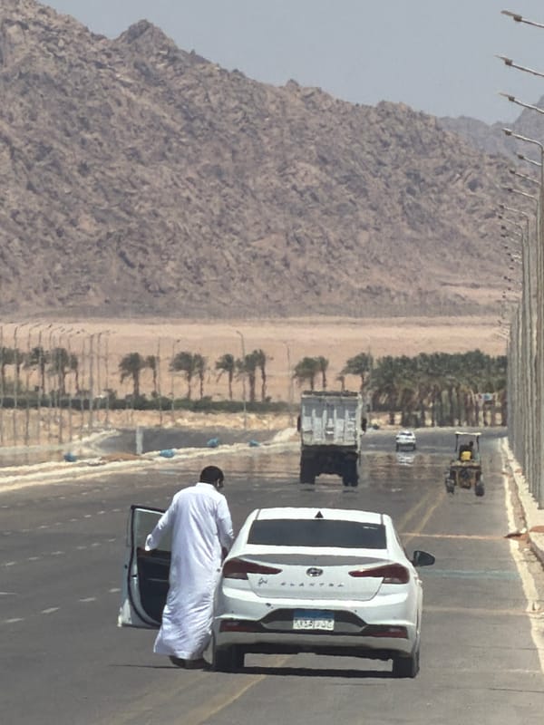 Roadside stop on an arid Egyptian highway, July morning