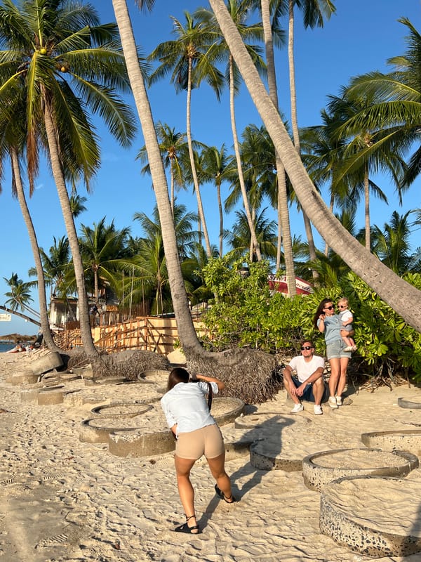 Family photoshoot amid beach construction at Thai resort
