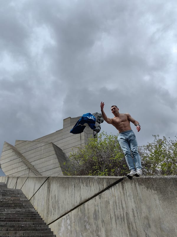 Man photographed suspended horizontally at Bulgarian State Monument