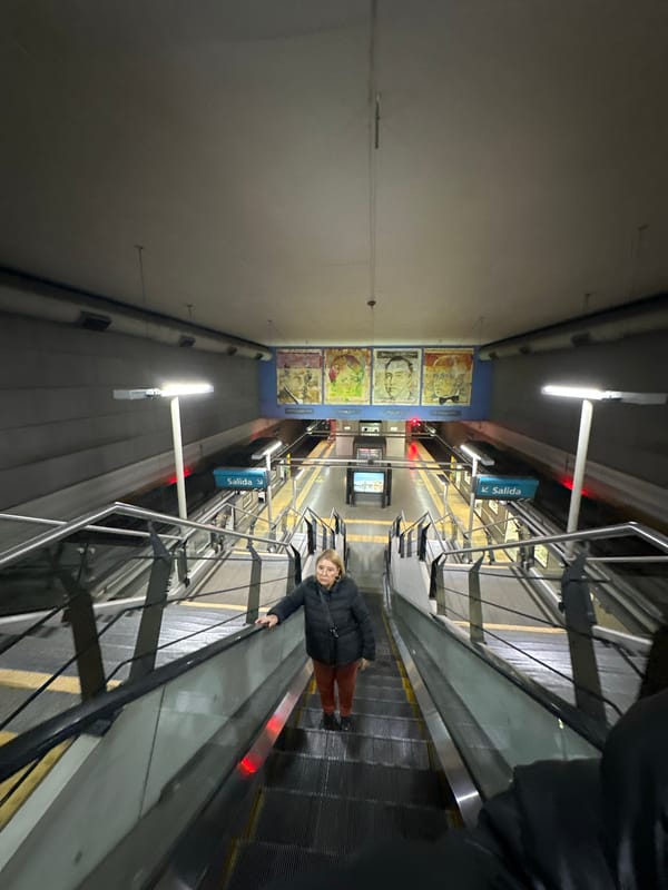 Woman rides escalator in Buenos Aires subway system