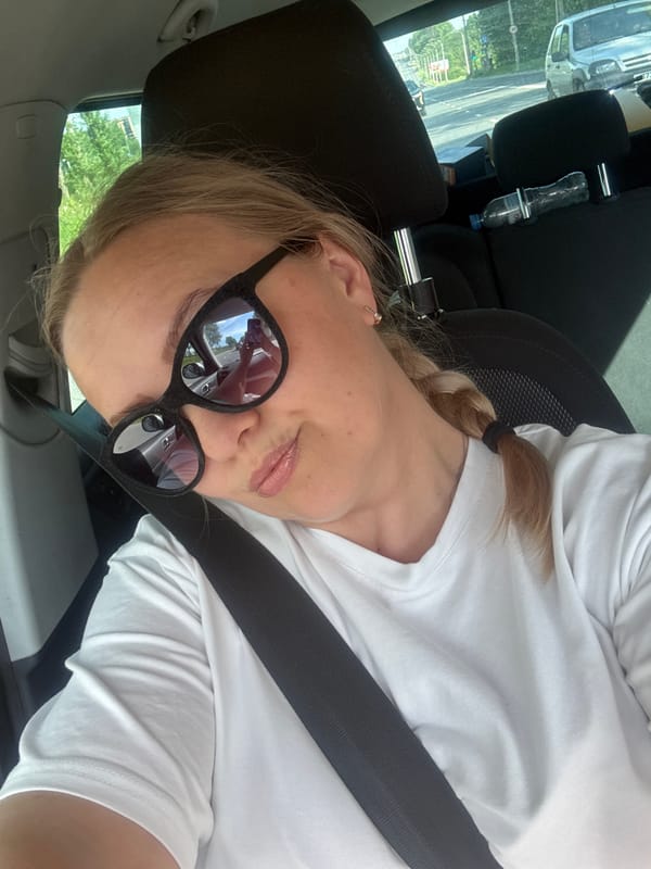 Woman takes selfies in car in Vologda, Russia
