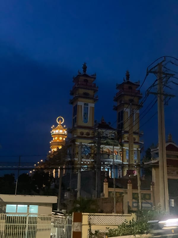 Illuminated temple towers at night in Phu Thuy Ward, Vietnam