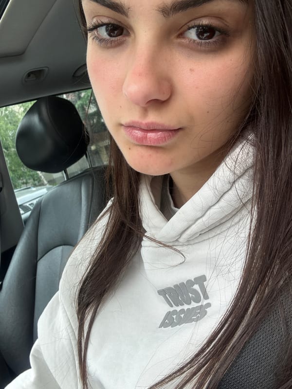 Woman in "Trust Issue" hoodie photographed in car, Blagoevgrad