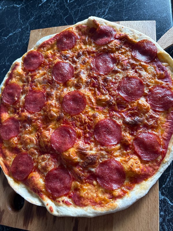 Fresh pepperoni pizza photographed in Hatne, Ukraine