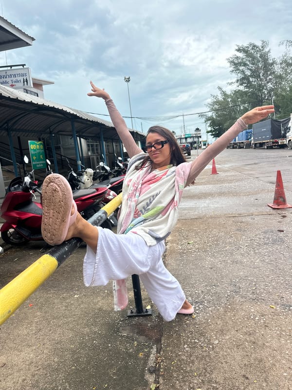 Casual photo stop near a public restroom in Thailand
