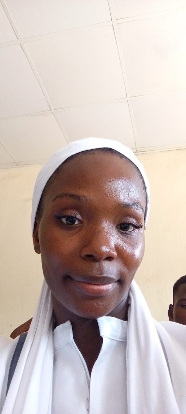 Students in white uniforms attend classroom session in Keffi