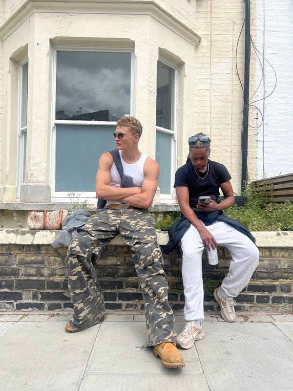 Young people gather, pose for photos outside London building