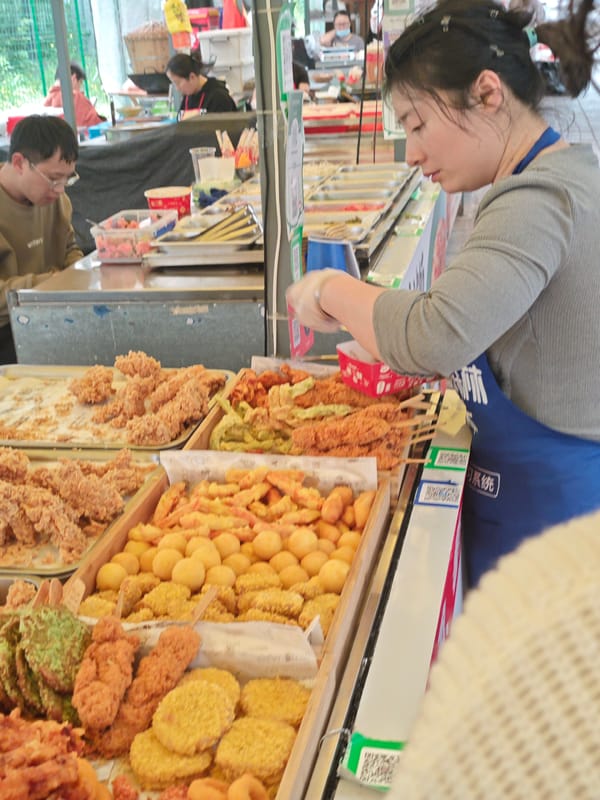 Street food vendors serve morning customers in Chongqing district