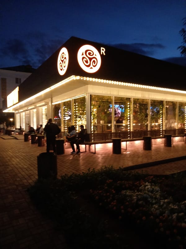Rudny's fountain lights up a damp summer evening