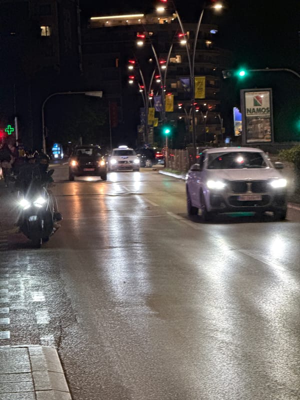 Evening street tour through wet Budva with garage stops