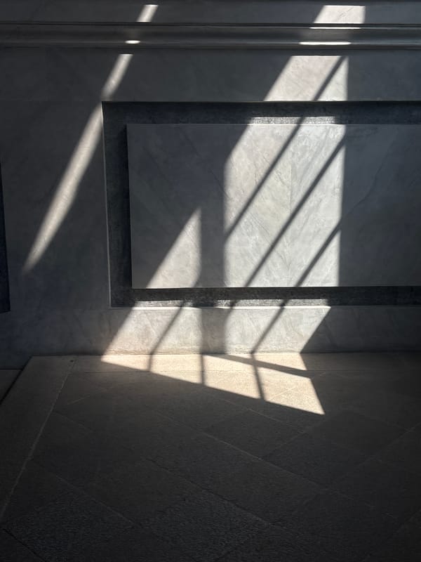 Art gallery visitors document textured paintings and sculptures in Milan