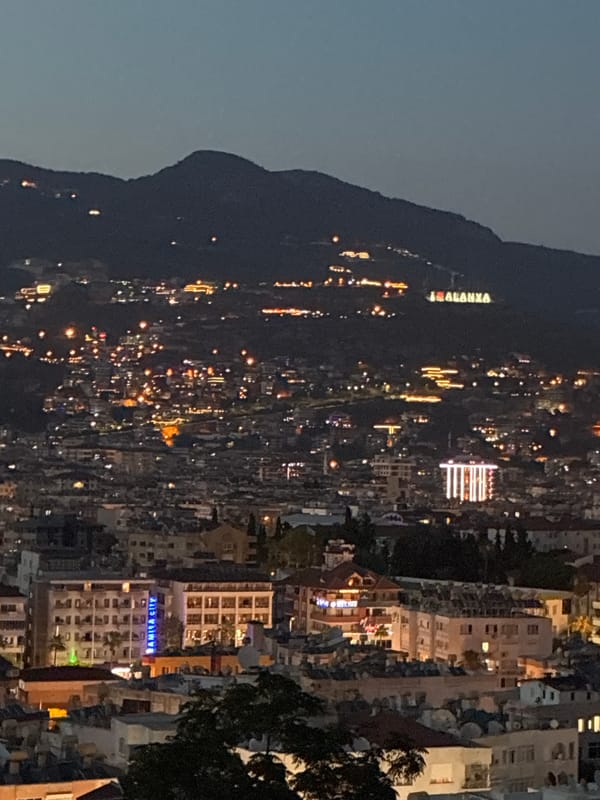 Alanya glows at night beneath its iconic mountain