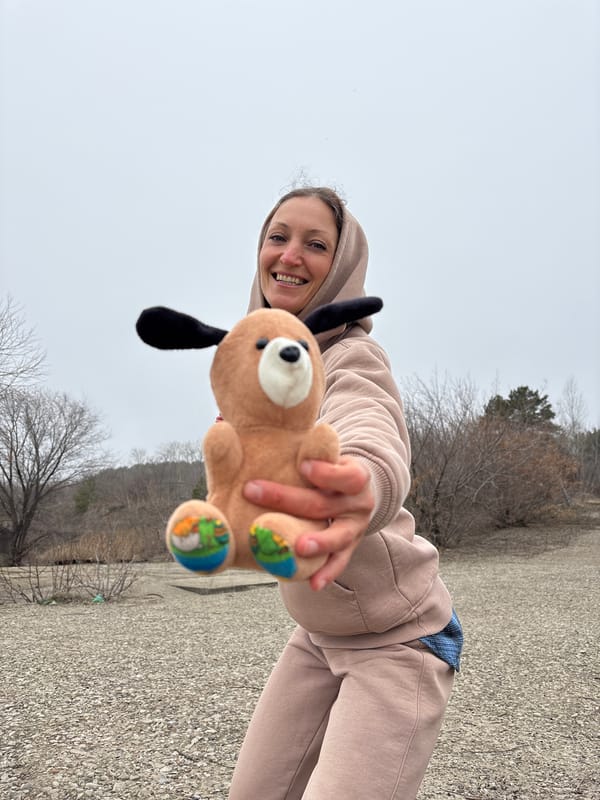 Woman shows plush dog toy to camera in Ulyanovsk