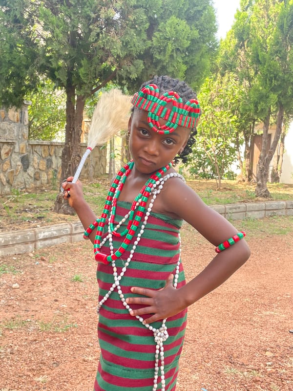 Young girl in traditional attire photographed in Kuru Karama
