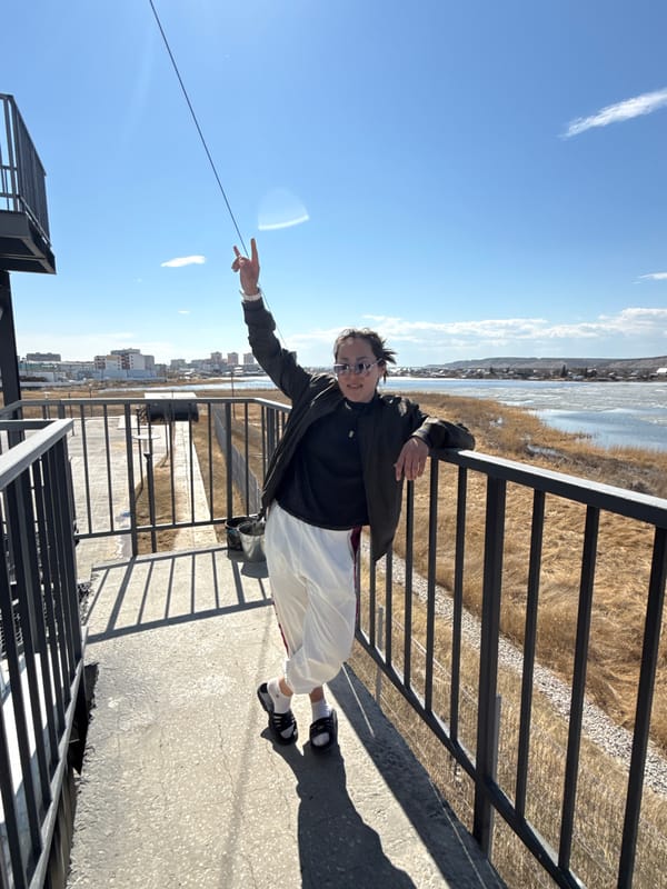 Man observes spring ice breakup from walkway in Yakutsk