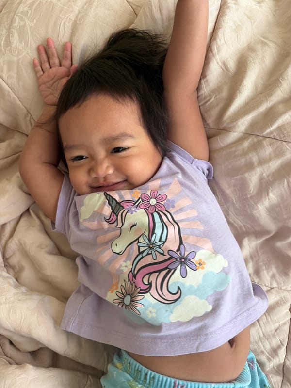 Cozy bedtime moments on a quilted blanket in Central Jakarta