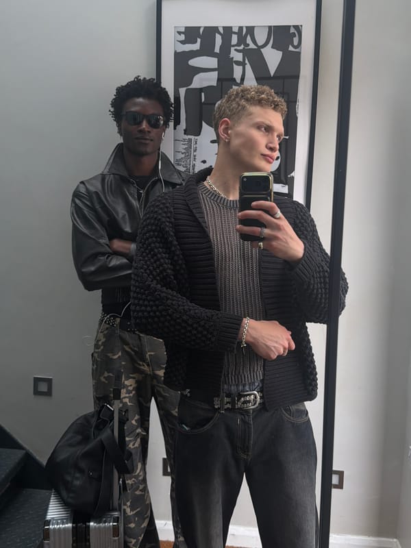Groups take mirror selfies in London indoor space