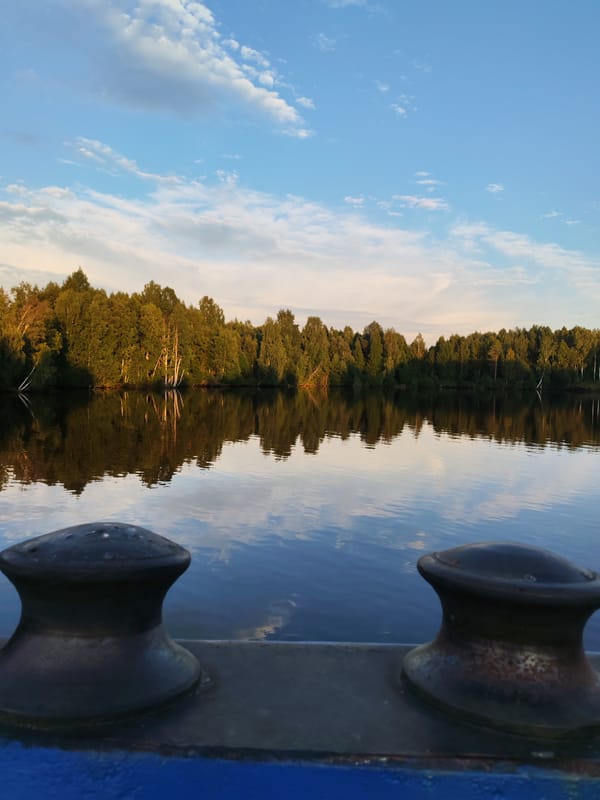 Calm reflections on the Vuoksa River at golden hour