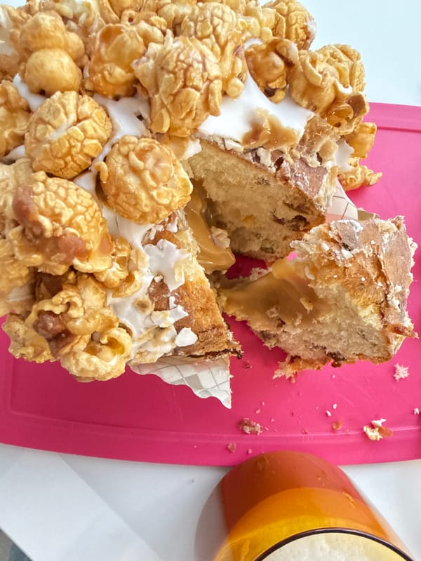Decorated caramel cake partially eaten in Saint Petersburg morning