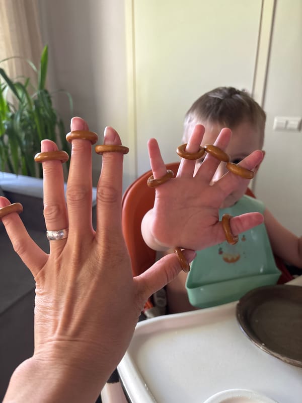 Adult and child wear pretzel rings as fingertip jewelry