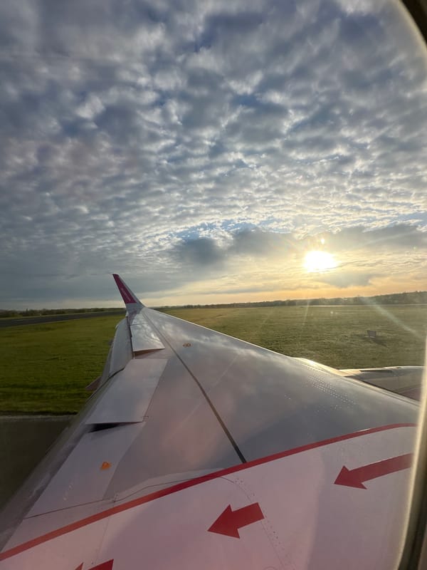 Passenger documents Wizz Air flight wing view over Dortmund