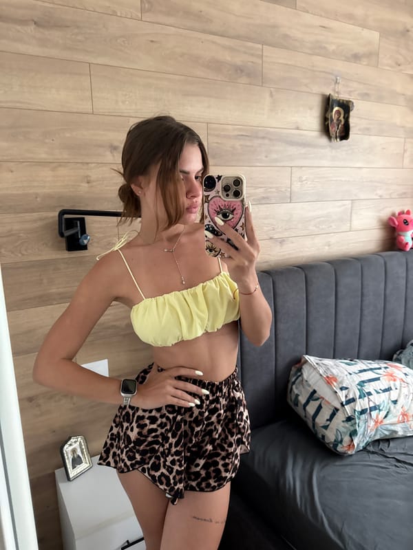 Woman Takes Multiple Mirror Selfies in Plovdiv Bedroom
