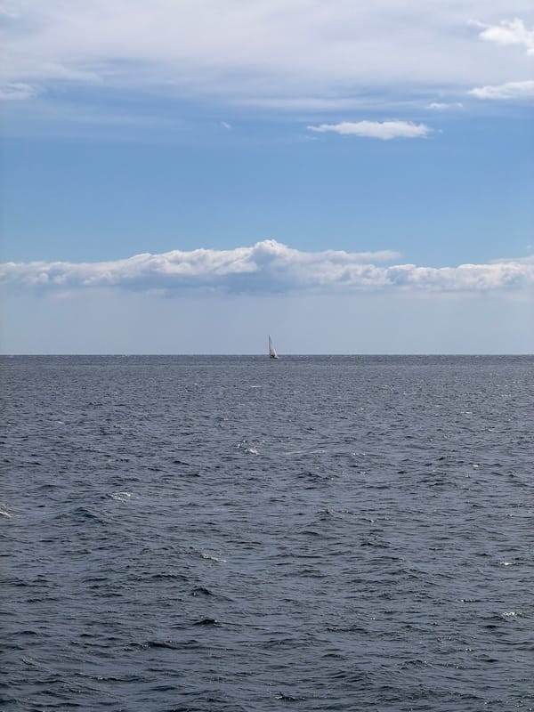Sailboat spotted under mixed skies off Turkish coast