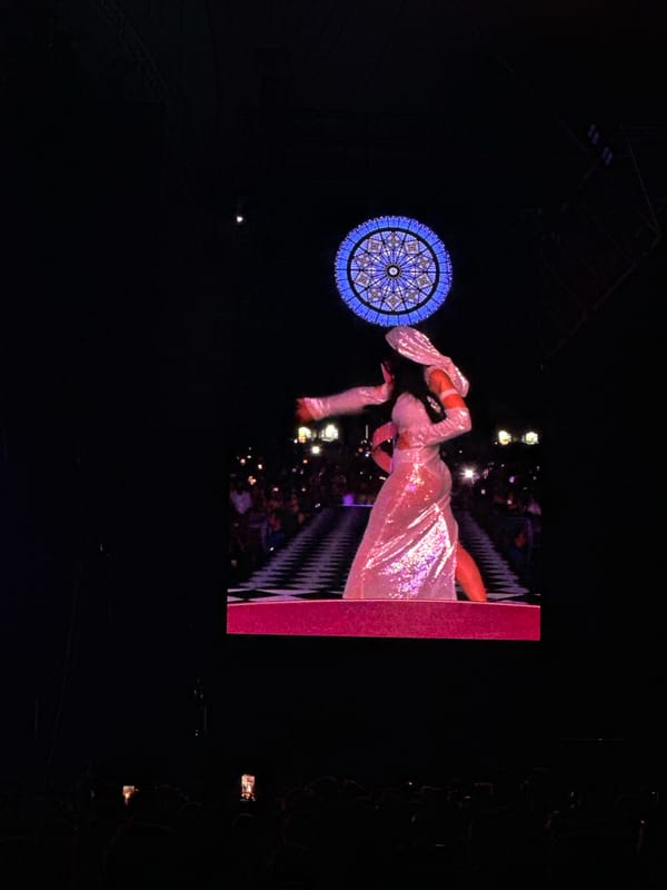 Female performer concerts in white dress at indoor venue