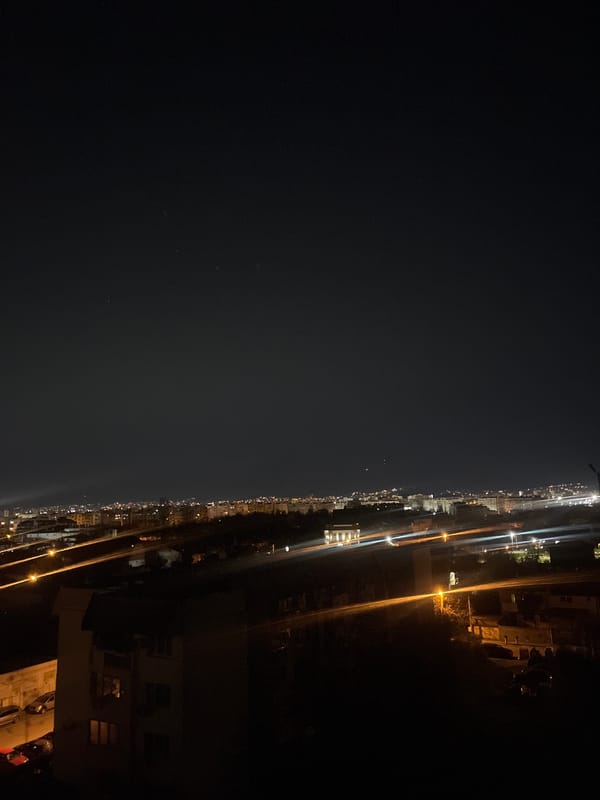 Nighttime aerial views of illuminated Sofia cityscape captured