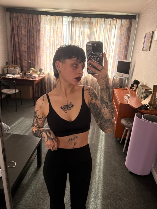 Tattooed individual documented smoking, selfies in Saint Petersburg