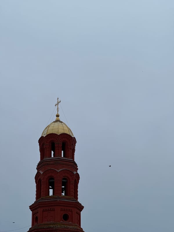 Bell tower with golden dome observed in Elovo, Russia