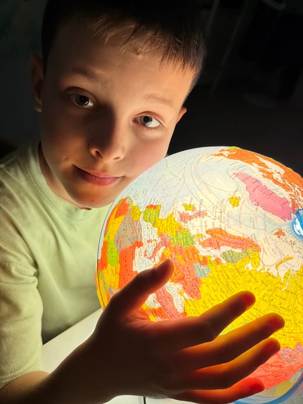Kids with a glowing globe, plus open water and parkside in Votkinsk