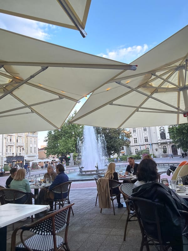 Outdoor dining observed near fountain in Plovdiv square