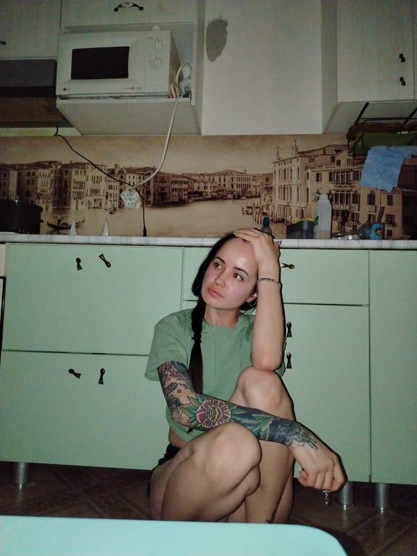 Indoor moments captured featuring decorated face and blanket-wrapped person