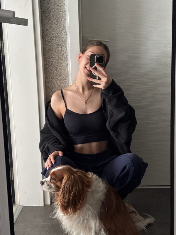 Woman takes mirror selfie in athletic wear, Sofia