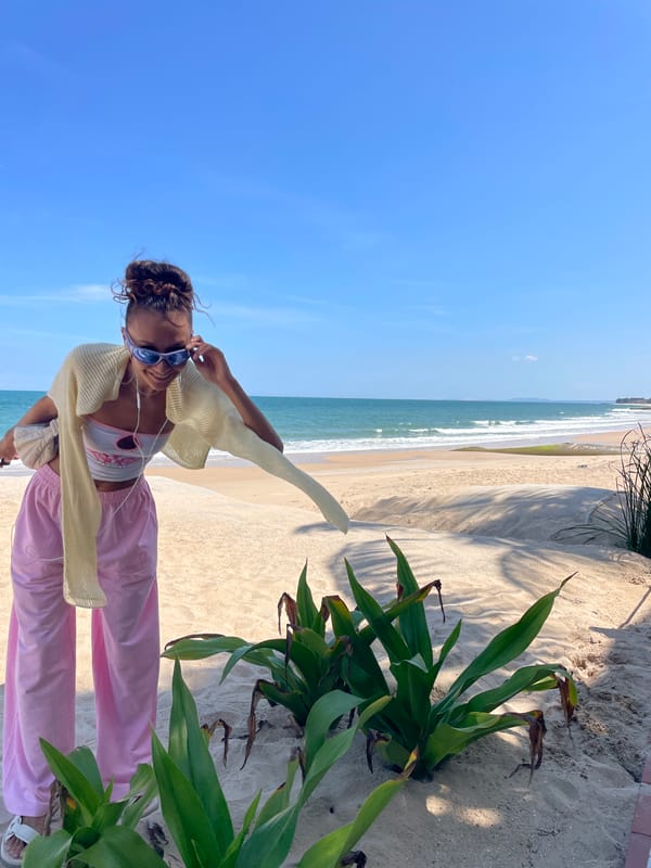 Woman poses on Vietnamese beach during early morning visit