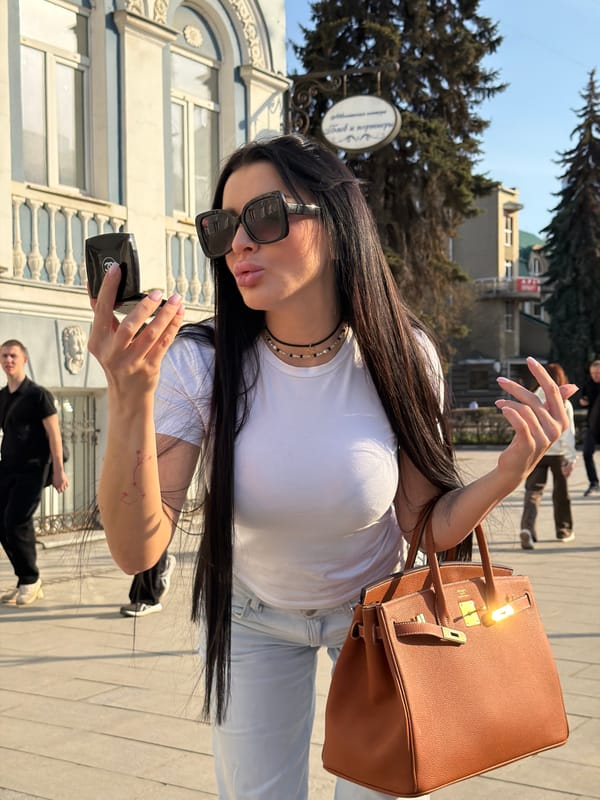 Street scenes captured in Voronezh featuring selfies and motorcycle