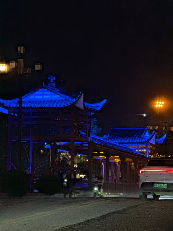 Traditional Chinese pavilions illuminated at night in Wulingyuan