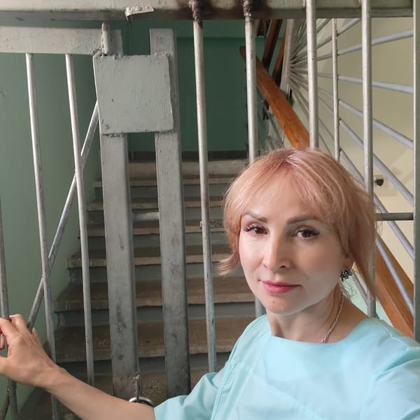 Pink-haired woman spotted near urban security gate