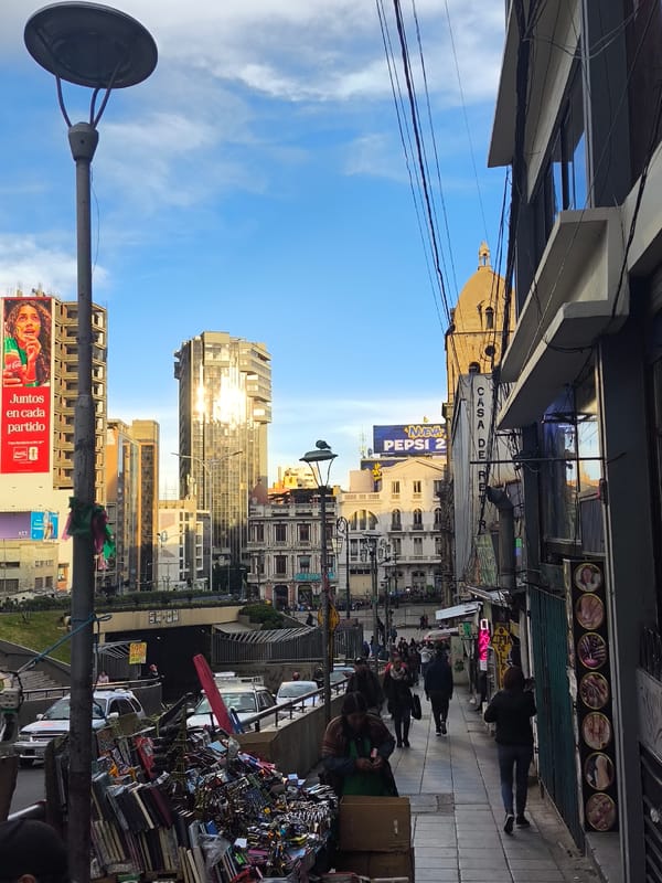 Evening street scenes captured across commercial areas of La Paz