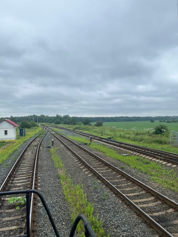 Aboard a train passing through Кемуль's railway yard